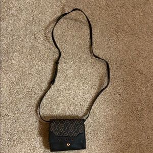 Small black purse with rose gold detail